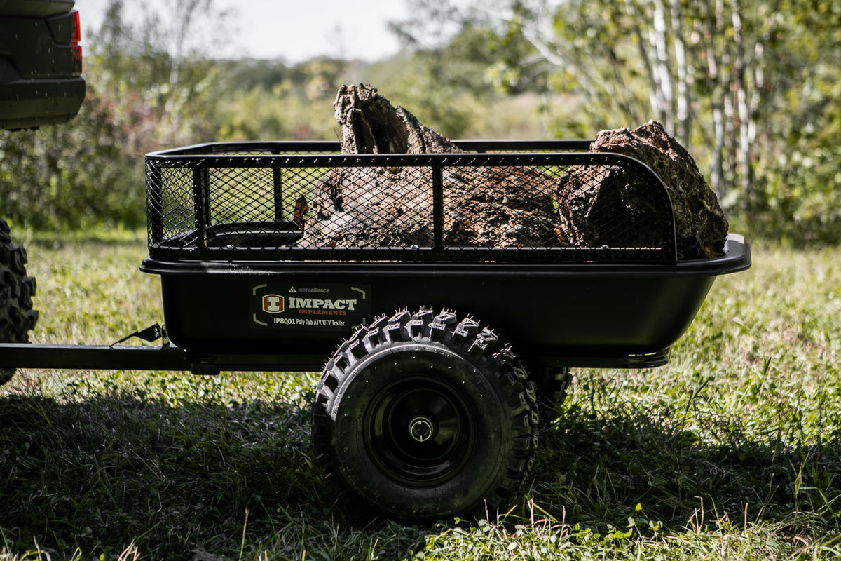 MotoAlliance poly tub trailer shows rugged 18x8 tires ready for varied terrain