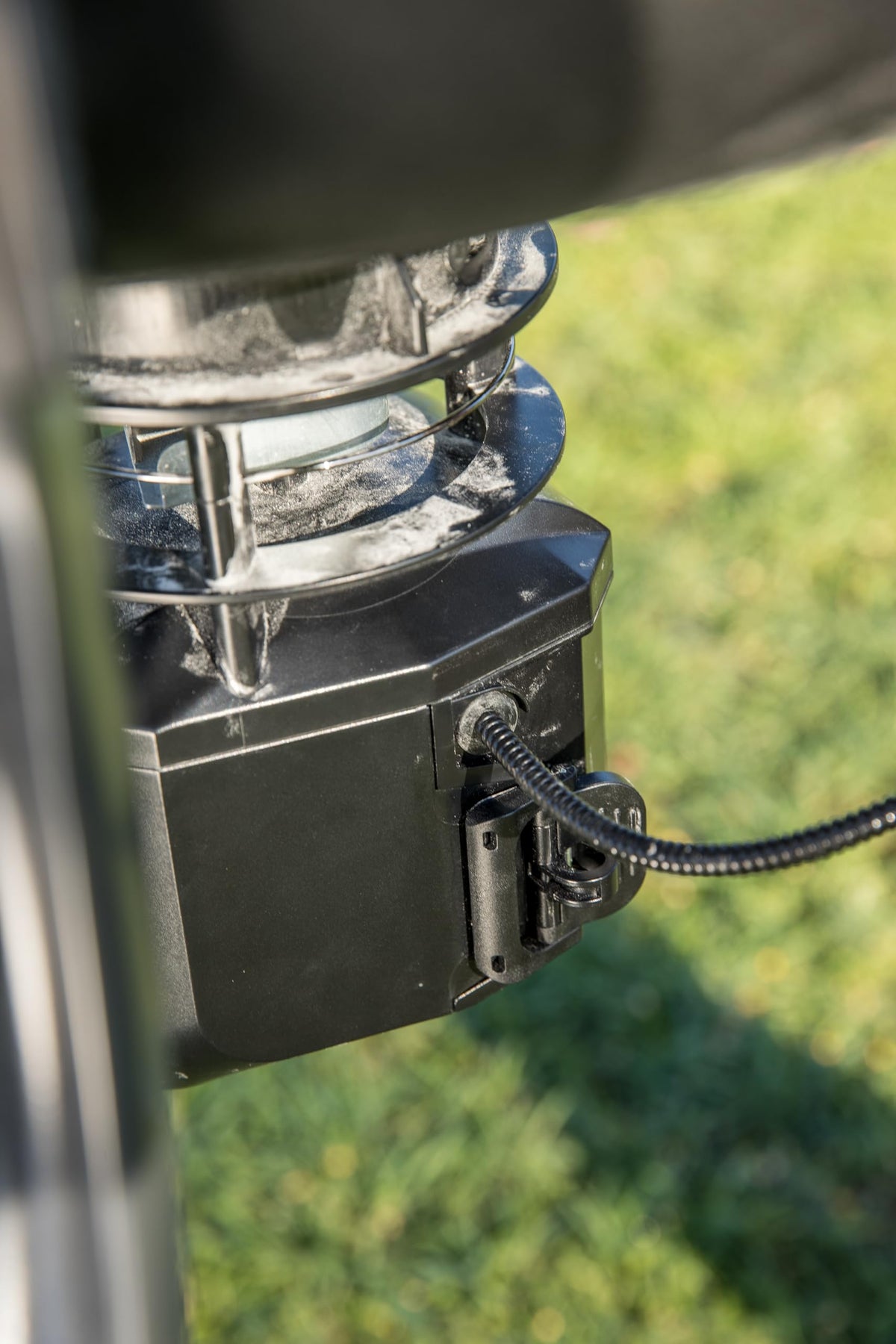 Moultrie bracket enables quick, secure installation on square feeder legs.