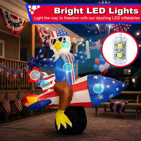 Mowholm LED nighttime display shines with colorful eagle inflatable.