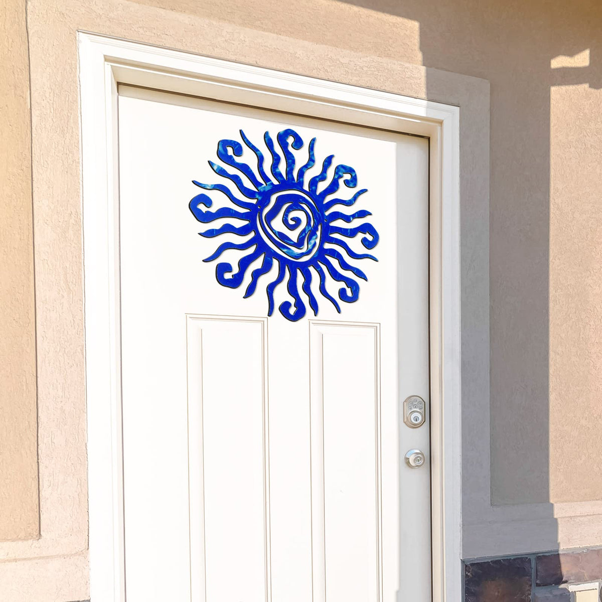 Moxweyeni indoor-outdoor sun wall art in vivid blue.