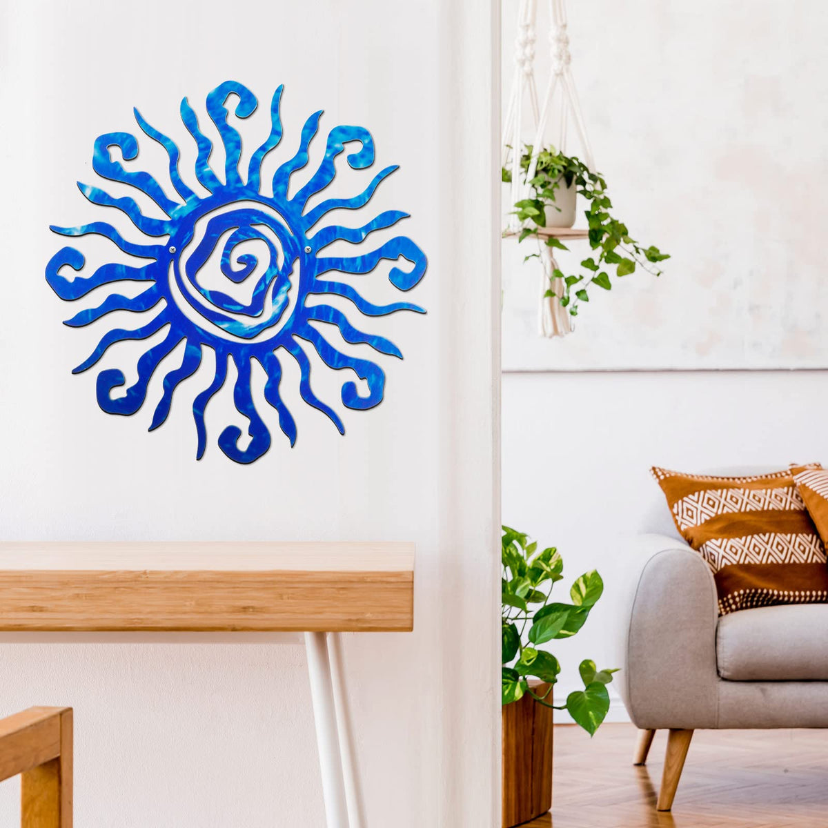 Moxweyeni blue sun wall decor with pre-drilled holes for hanging.