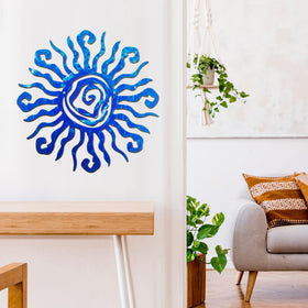 Moxweyeni blue sun wall decor with pre-drilled holes for hanging.