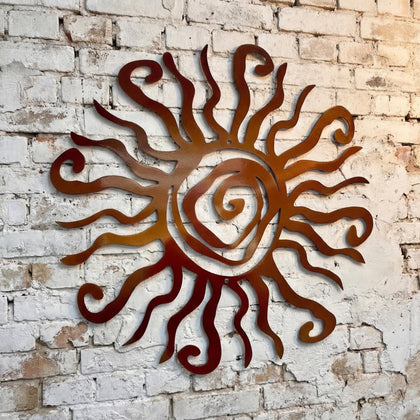 Moxweyeni sun wall art large durable metal hangs boldly on outdoor walls.