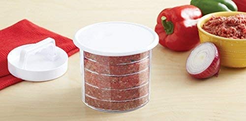 Mr. Bar-B-Q burger smash tool on griddle for quick sear and even patties.