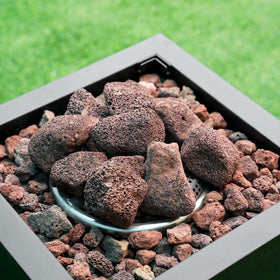 Mr. Fireglass lava rock granules for indoor fireplaces offer rustic, heat-retentive charm