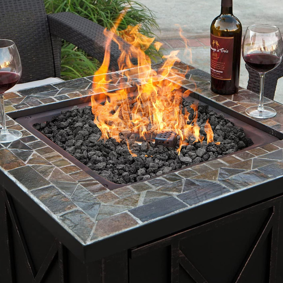 Mr. Fireglass lava rock helps conceal pipes and rough edges in garden beds.