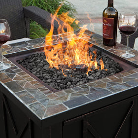 Mr. Fireglass lava rock helps conceal pipes and rough edges in garden beds.