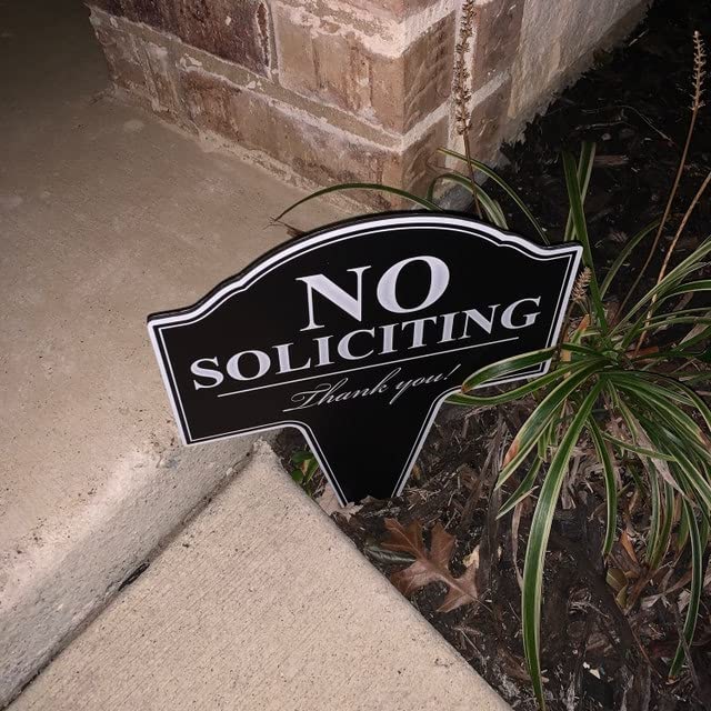 Storefront No Soliciting sign by MRC Wood Products mounted to deter solicitations politely
