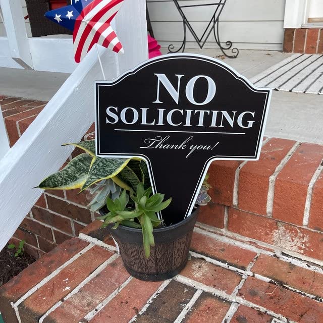 Close up of MRC Wood Products No Soliciting sign showing crisp white text on black background