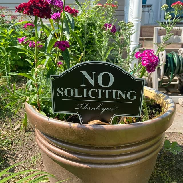 Yard sign with stake from MRC Wood Products defining entryway boundaries