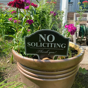 Yard sign with stake from MRC Wood Products defining entryway boundaries