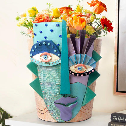 Mrlikale abstract face planter front view with bold colors for indoor decor.