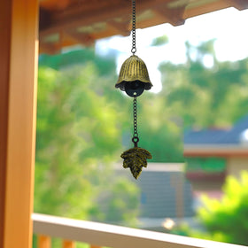 MrMrKura outdoor hanging wind chime in a garden setting for serene breeze.