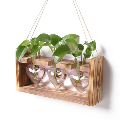 MTsigns plant terrarium heart vase on wooden stand enhances desk aesthetics and natural charm.