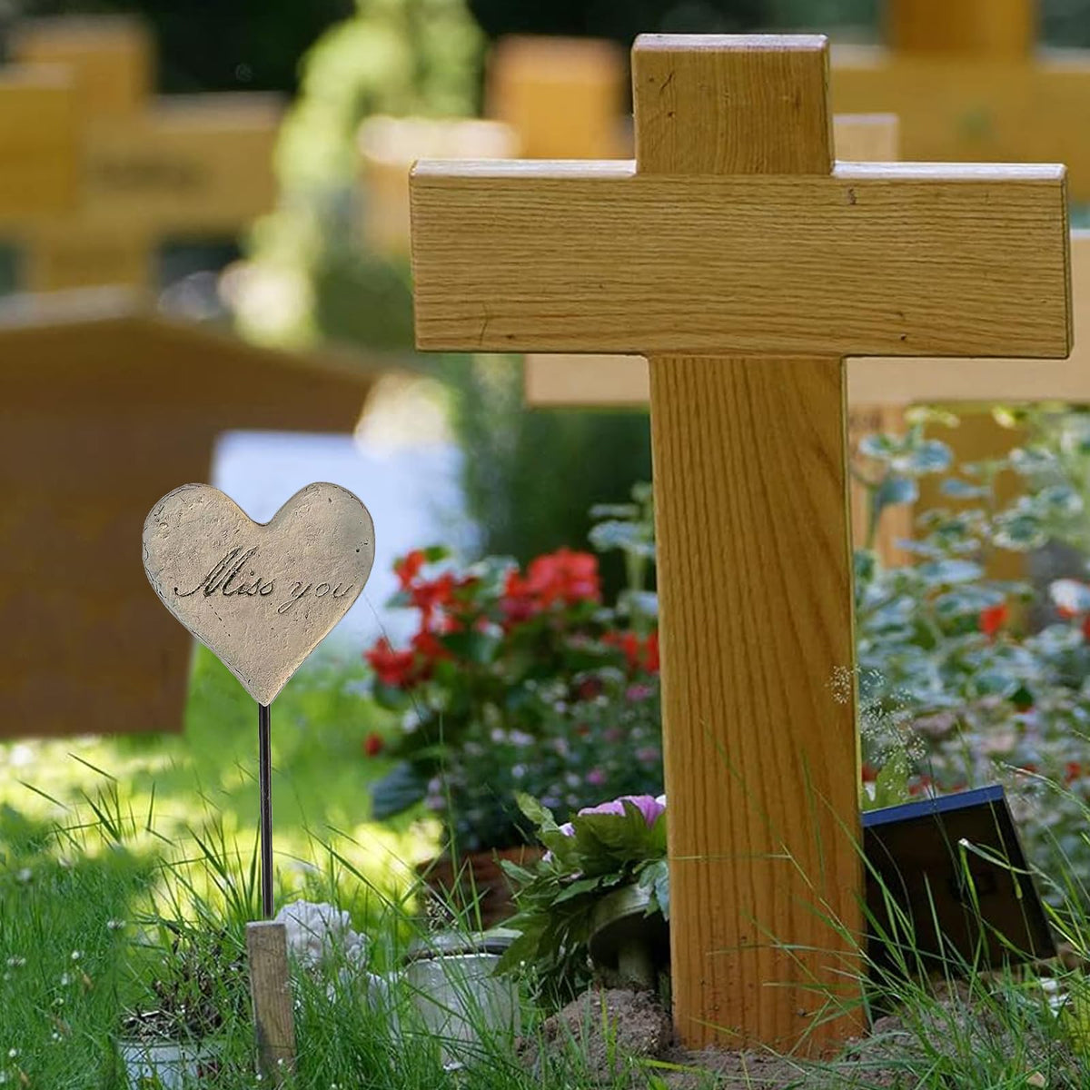 MUAMAX gravesite decor stake in a garden display