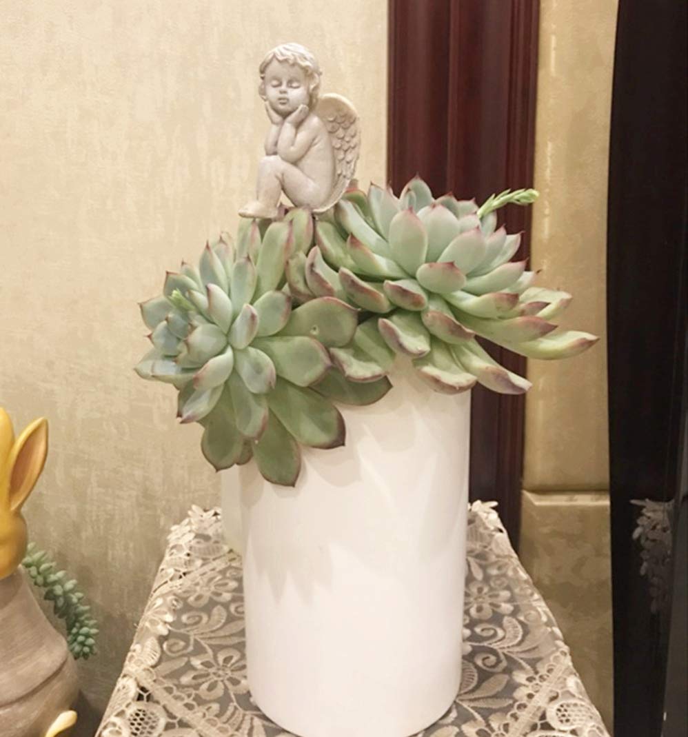 MUAMAX indoor-outdoor angel figurine brightens mini gardens and pots.