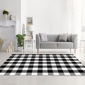 MUBIN black and white plaid rug anchors dining room decor.