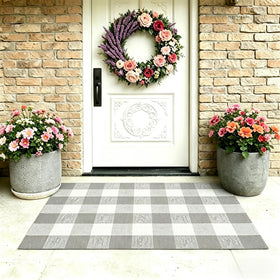 MUBIN buffalo plaid rug placed on a porch blends indoor comfort.