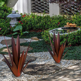 Muciwa agave sculpture red in garden setting enhances outdoor decor.