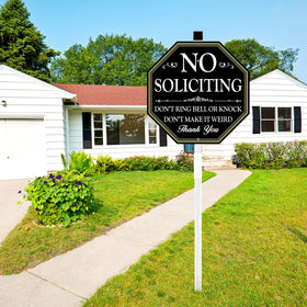 Side-yard view showing how the sign fits into landscaping and sidewalks.