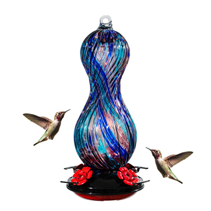 Muse Garden hummingbird feeder outdoor glass enhances garden color and bird attraction.