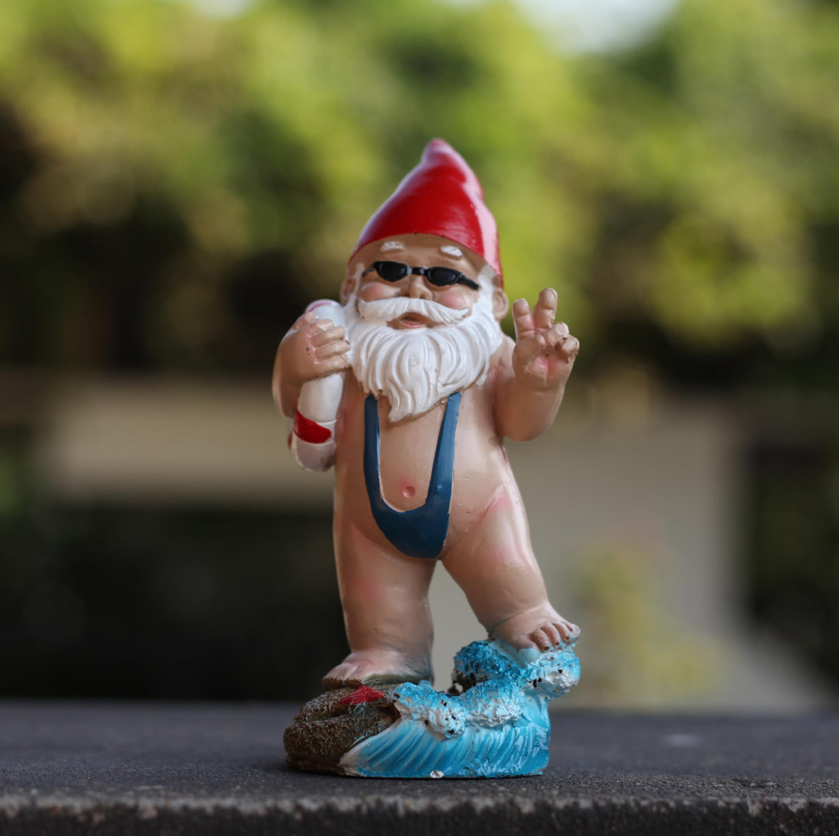 Mystic Manuscript Swimming Dwarf on porch display creates cozy spaces