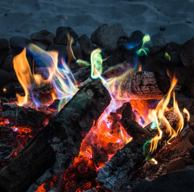 Mystical Fire color changing packets cast orange flames for warm, cozy nights.