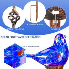 Naboher dark blue glass stake offering ambient evening light for patios