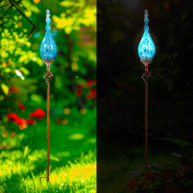 Naboher garden art glows to enhance daytime and night ambience.