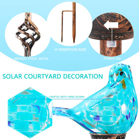 Naboher hand blown glass bird stake adds artful ambience along patios after sunset