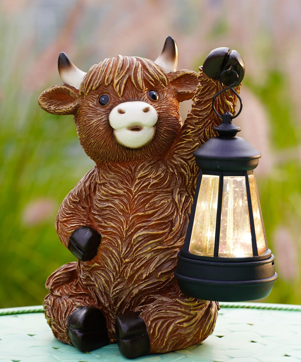 Nacome Highland Cow statue in the garden adds charming outdoor decor.