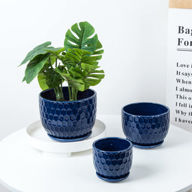 Nattol navy blue round planter on a windowsill for indoor styling.