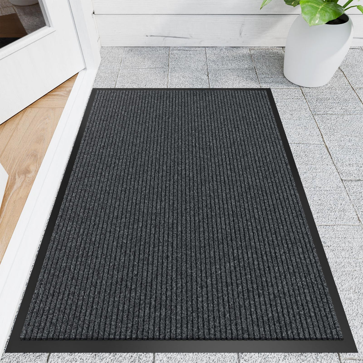 Naturei front door mat showing dirt-absorbing grooves for cleaner entryways.
