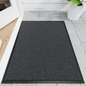 Naturei front door mat showing dirt-absorbing grooves for cleaner entryways.