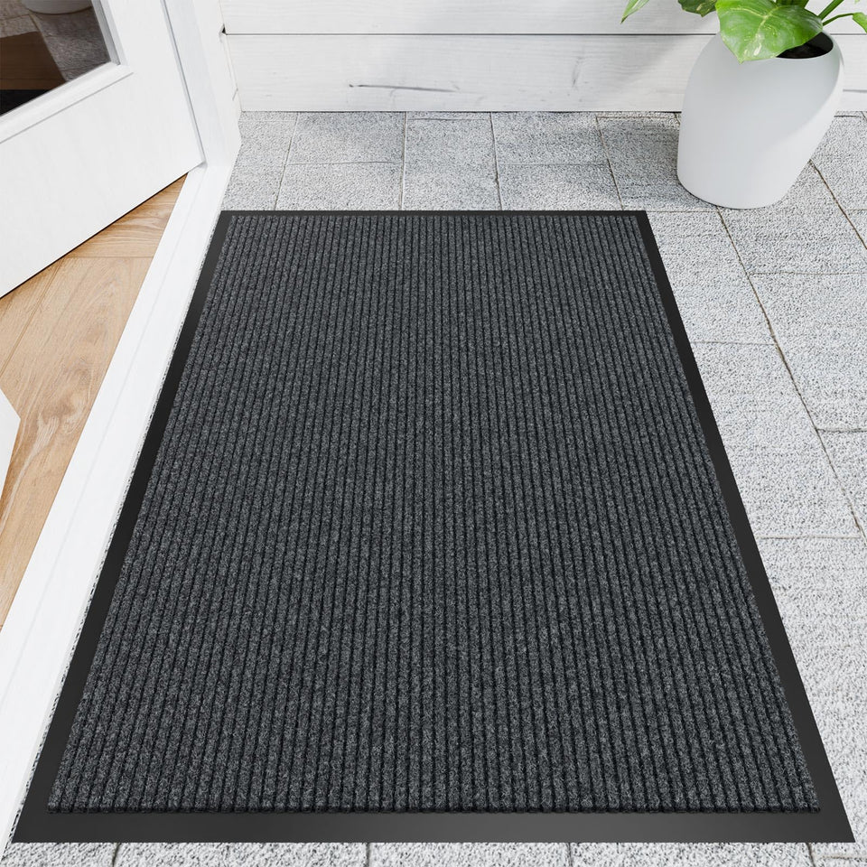 Naturei front door mat showing dirt-absorbing grooves for cleaner entryways.