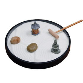 Nature's Mark Zen Garden base with white sand and river rocks on desk