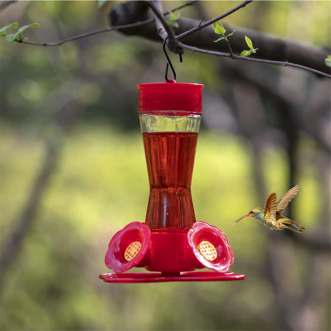 Nature's Rhythm hummingbird feeder on patio ready for birds.