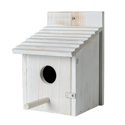 Natureylwl wooden bird house outdoors with perch inviting finches and bluebirds.