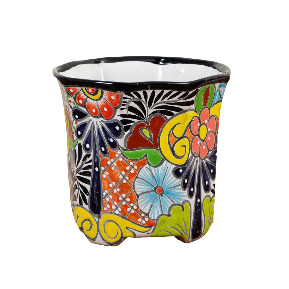 Nearly Natural Talavera planter with hand-painted design, ideal for bright living room decor.