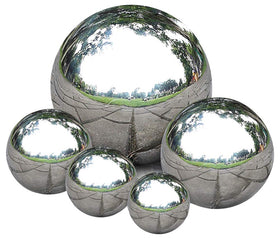 Nerien gazing ball 40mm polished silver reflects surrounding interiors with clarity.