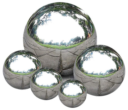 Nerien gazing ball 40mm polished silver reflects surrounding interiors with clarity.