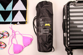 Neso sand-anchor bags secure shade using natural beach resources
