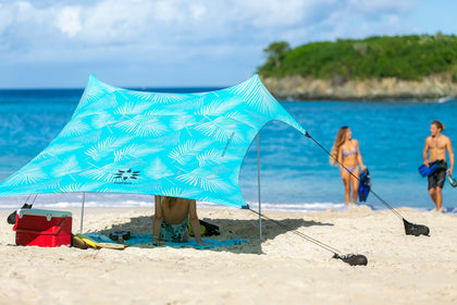 Neso sand-anchor beach tent provides stable shade on windy beaches