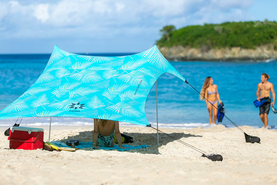 Neso sand-anchor beach tent provides stable shade on windy beaches