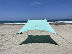 Neso Seafoam portable beach tent providing roomy shade for family outings