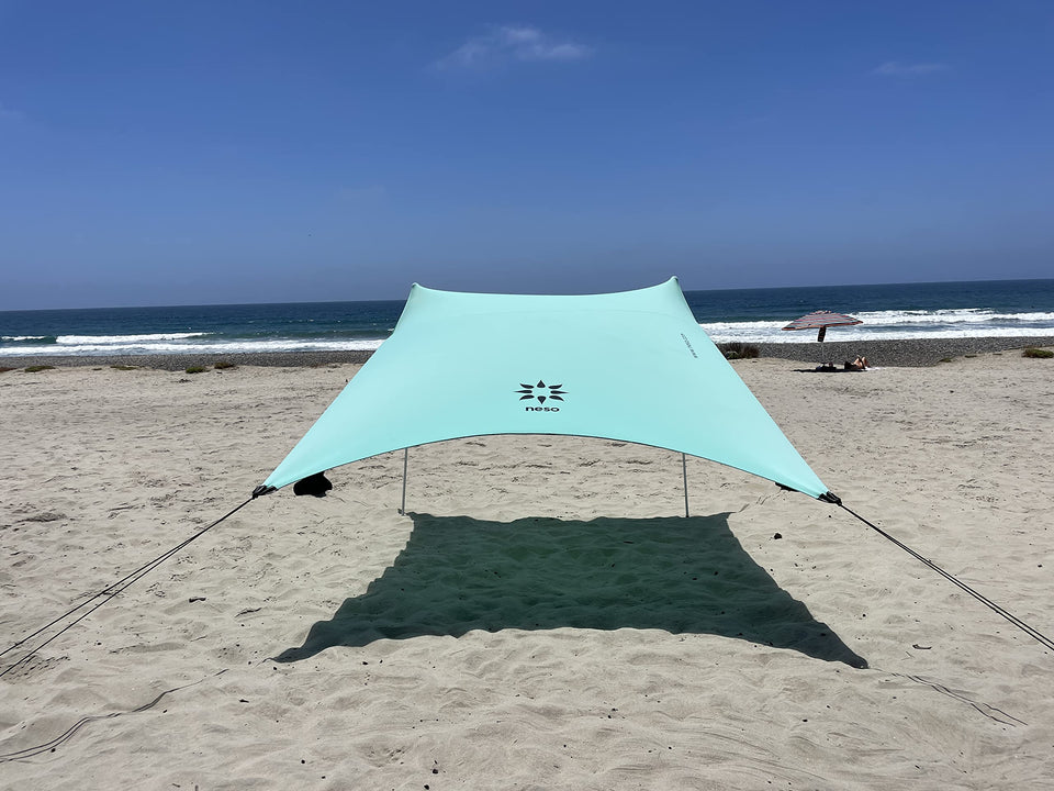 Neso Seafoam portable beach tent providing roomy shade for family outings