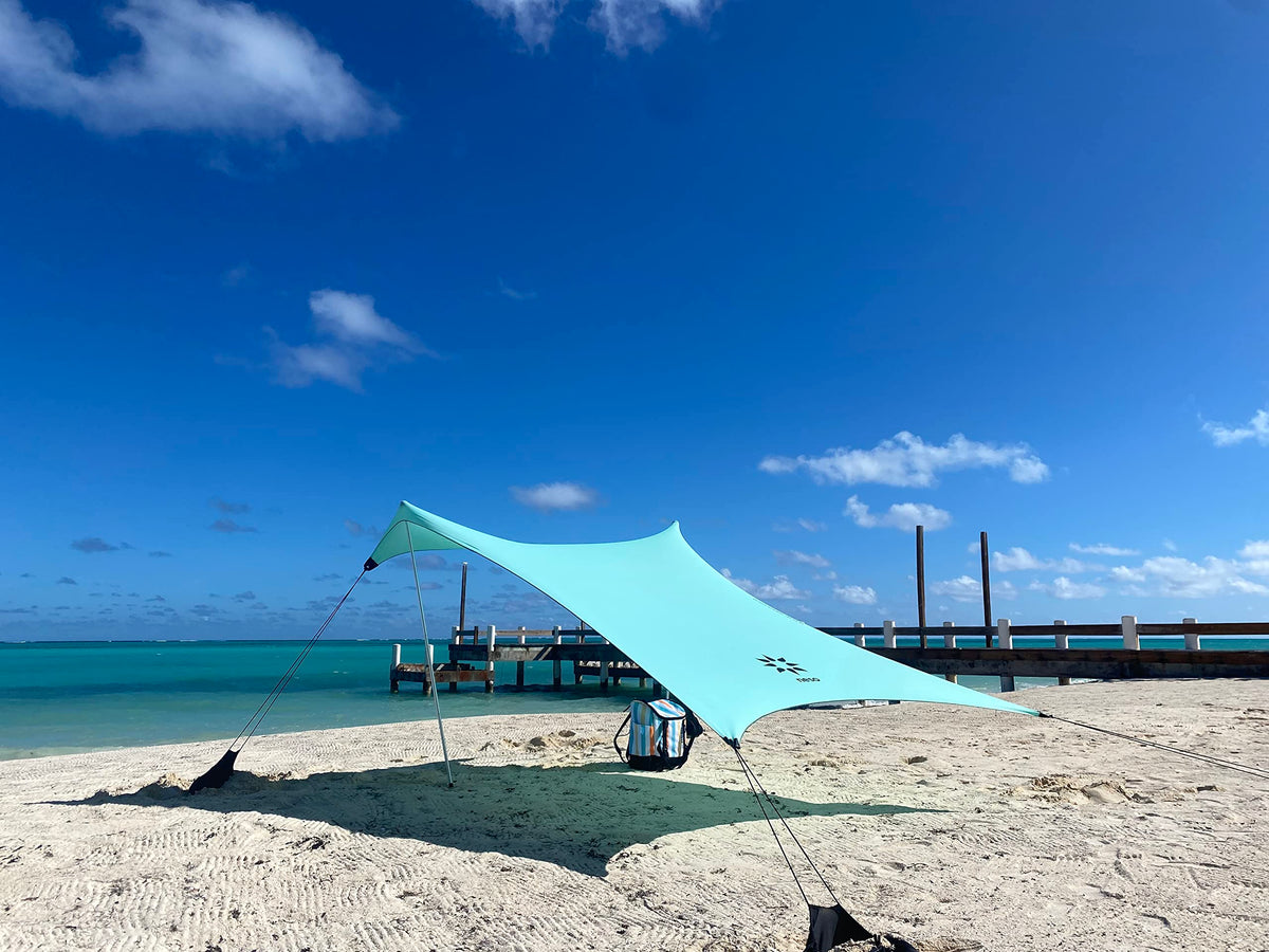 Neso Seafoam sand-anchor in action keeps canopy stable on shore