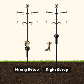 Pole setup outdoors for hanging bird feeders and baths