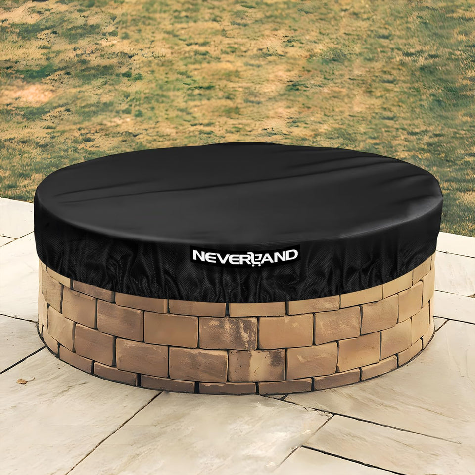 NeverLAND round fire pit cover 66-inch front view protects built-in stone pits from rain.