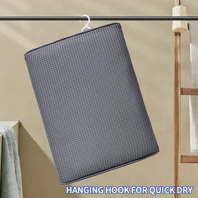 Newivi 2-pack shower-chair cushion gray used on a bath chair for seating.